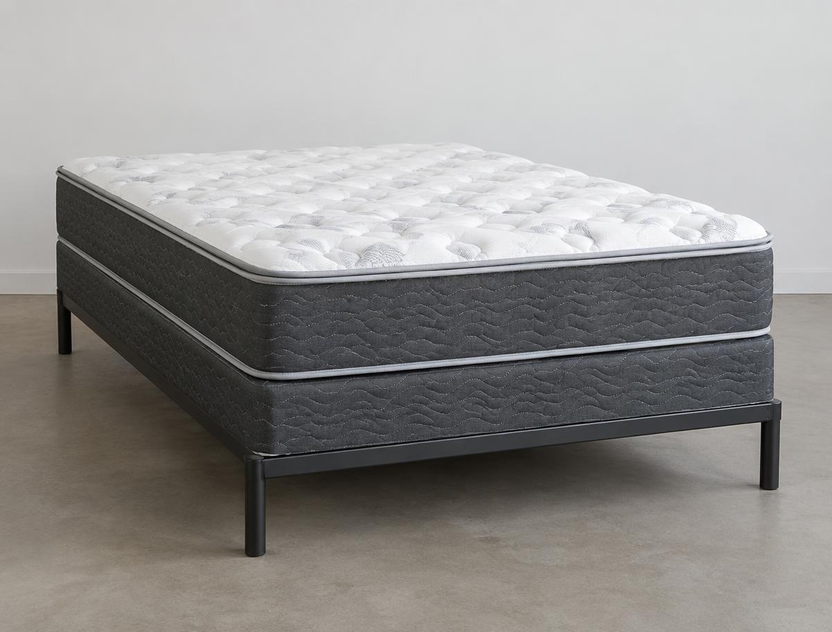 Brand-new mattress and box spring set on a metal frame